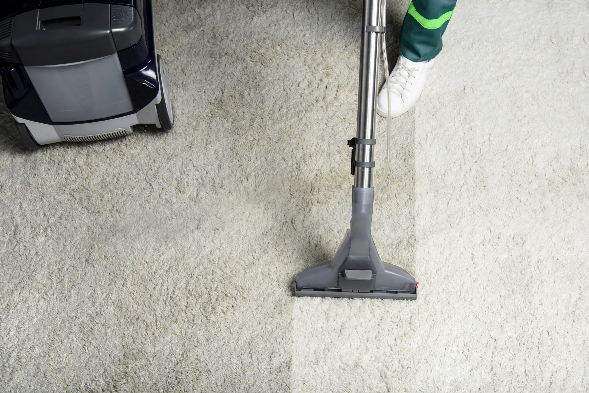 Vacuum leaving a clean stripe across a textured pile carpet